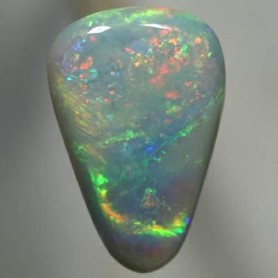 SOLID SEMI BLACK OPAL Sparkling orange moves to green rolling flashes